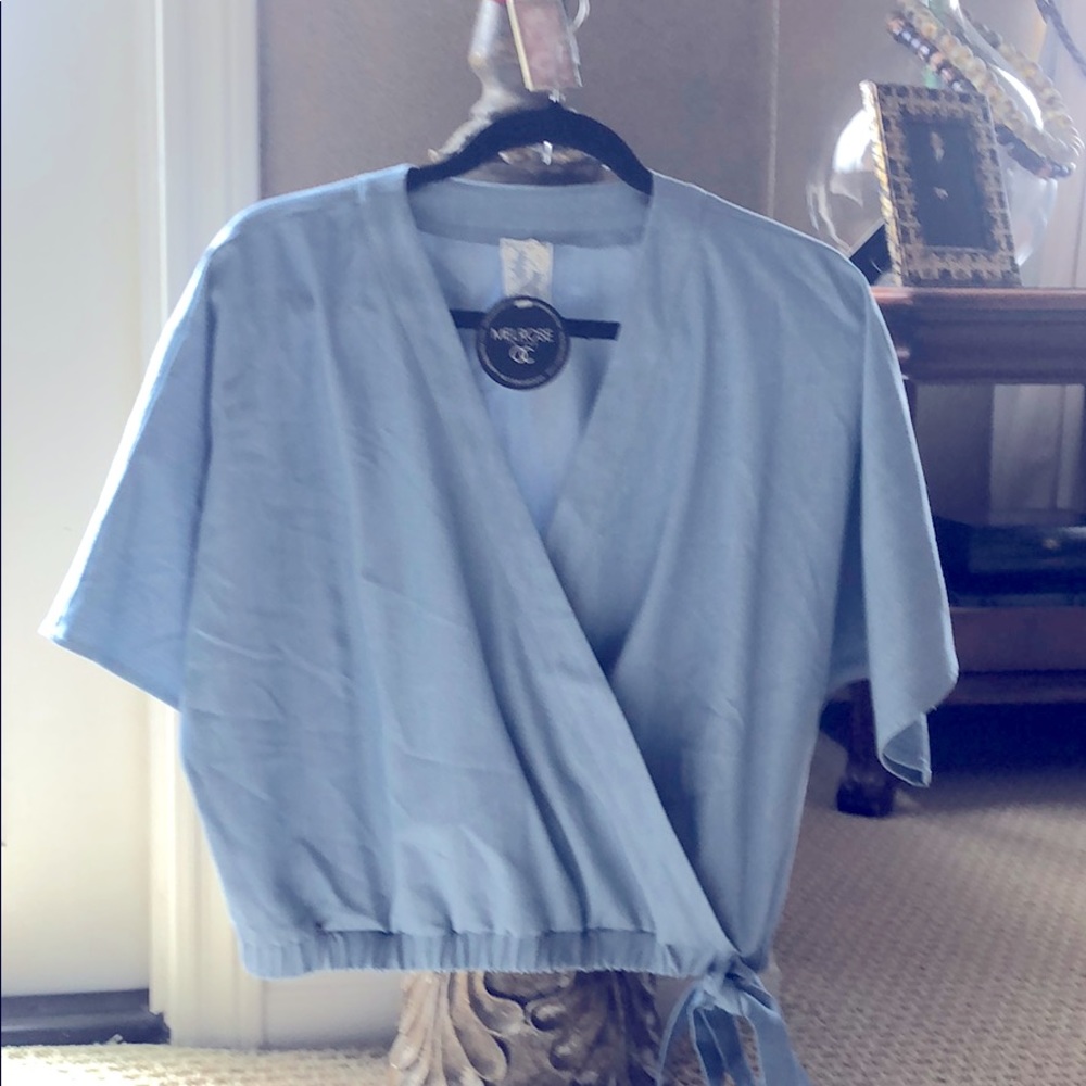 Brand new, short sleeve tie bottom v neck top.